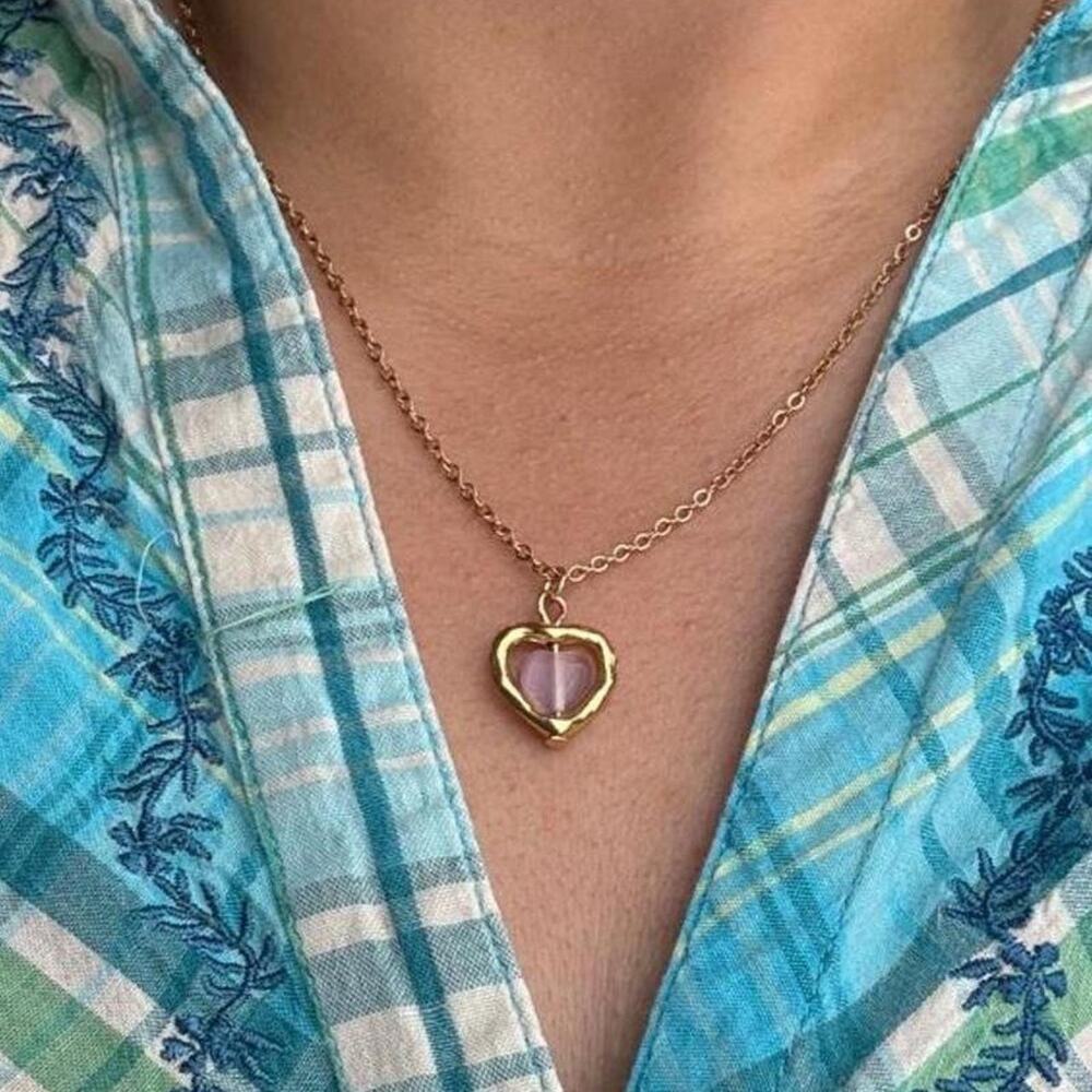 Gold heart pendant necklace with